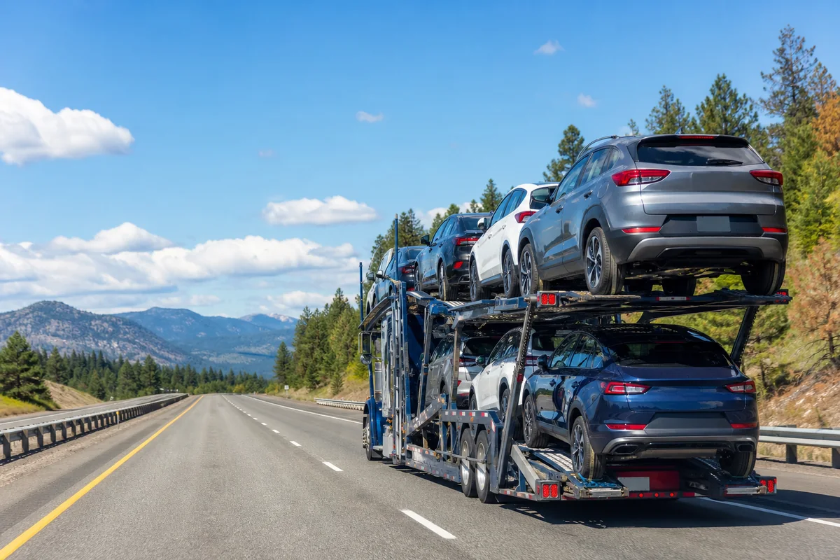 Auto carrier transporting passenger vehicles on a daytime route